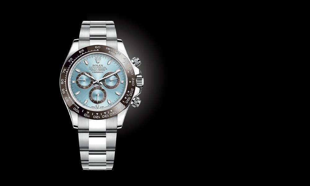 Silver Rolex Oyster Perpetual on a black background