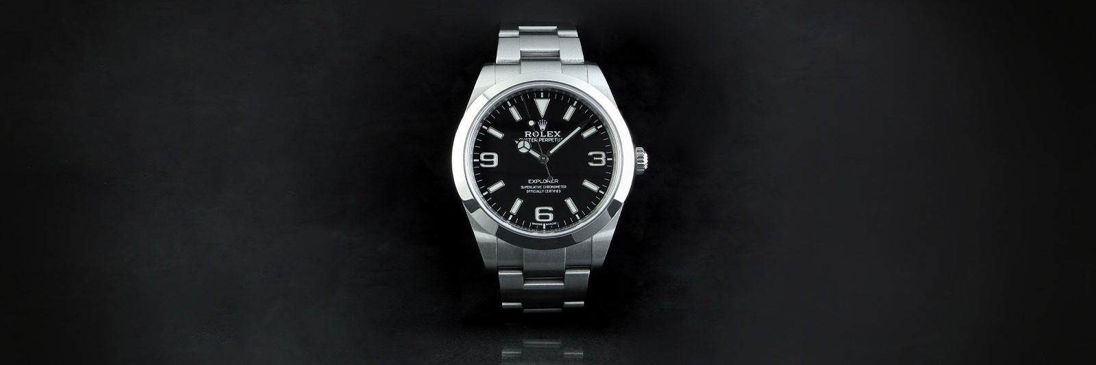 stainless steel rolex on a black background showing one option for purchasing your first rolex