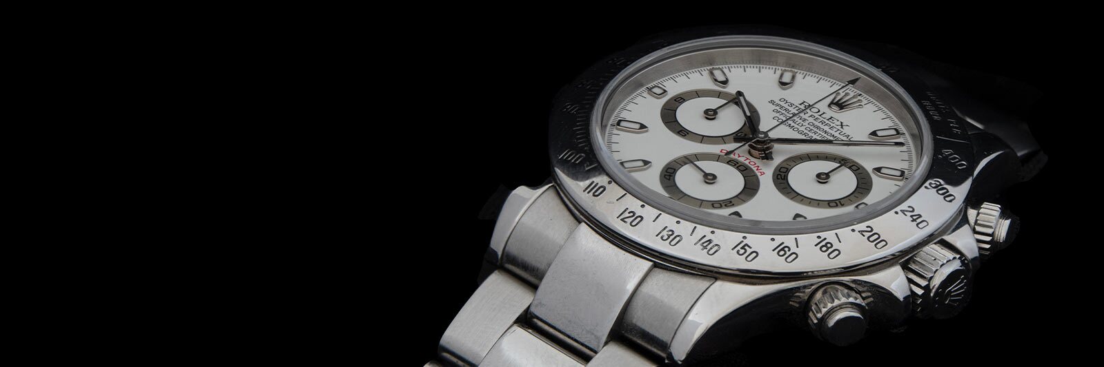 silver rolex daytona on black background
