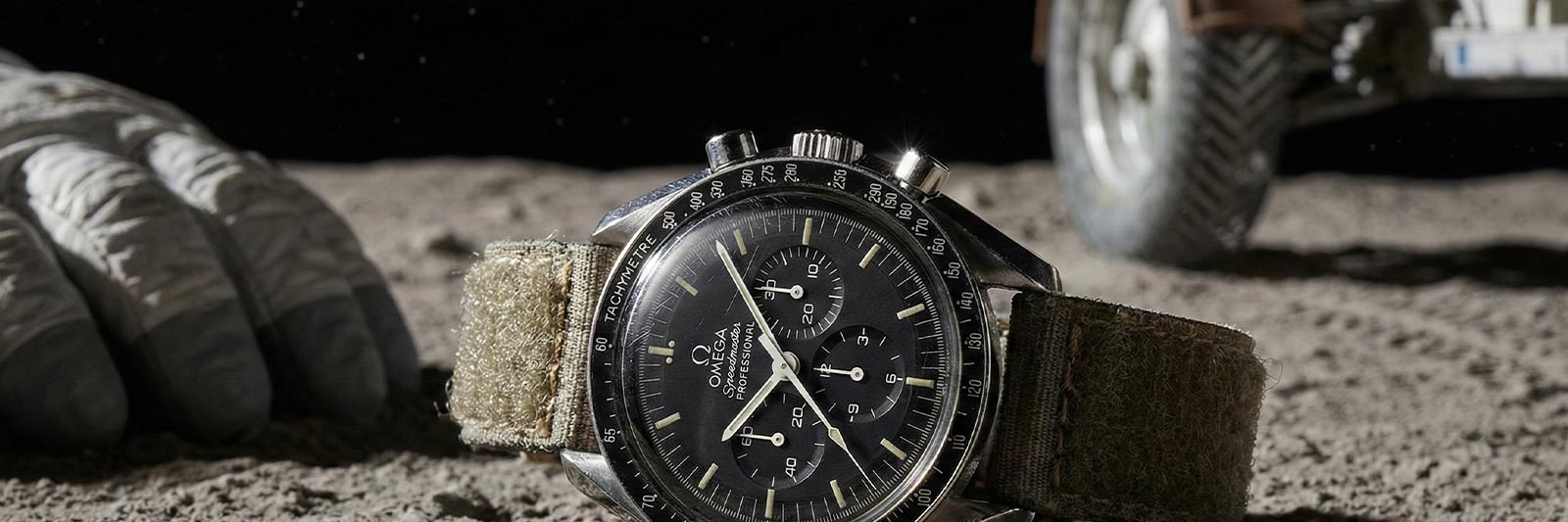 Omega Speedmaster Moonwatch on the moon next to space gloves