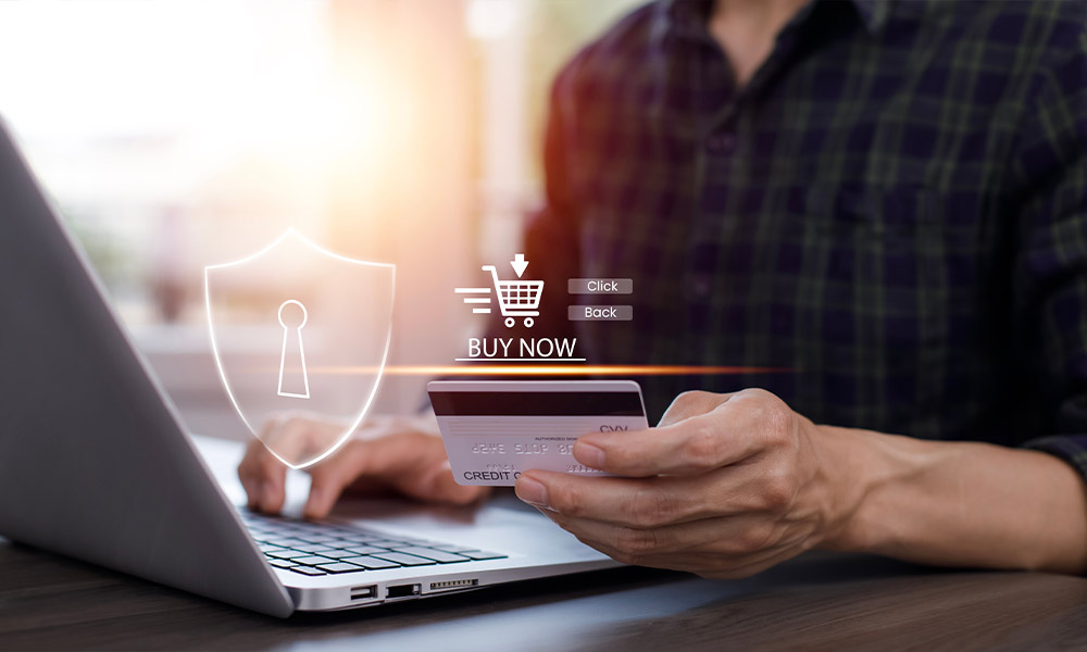 Man purchasing a watch on his laptop using our watch escrow services